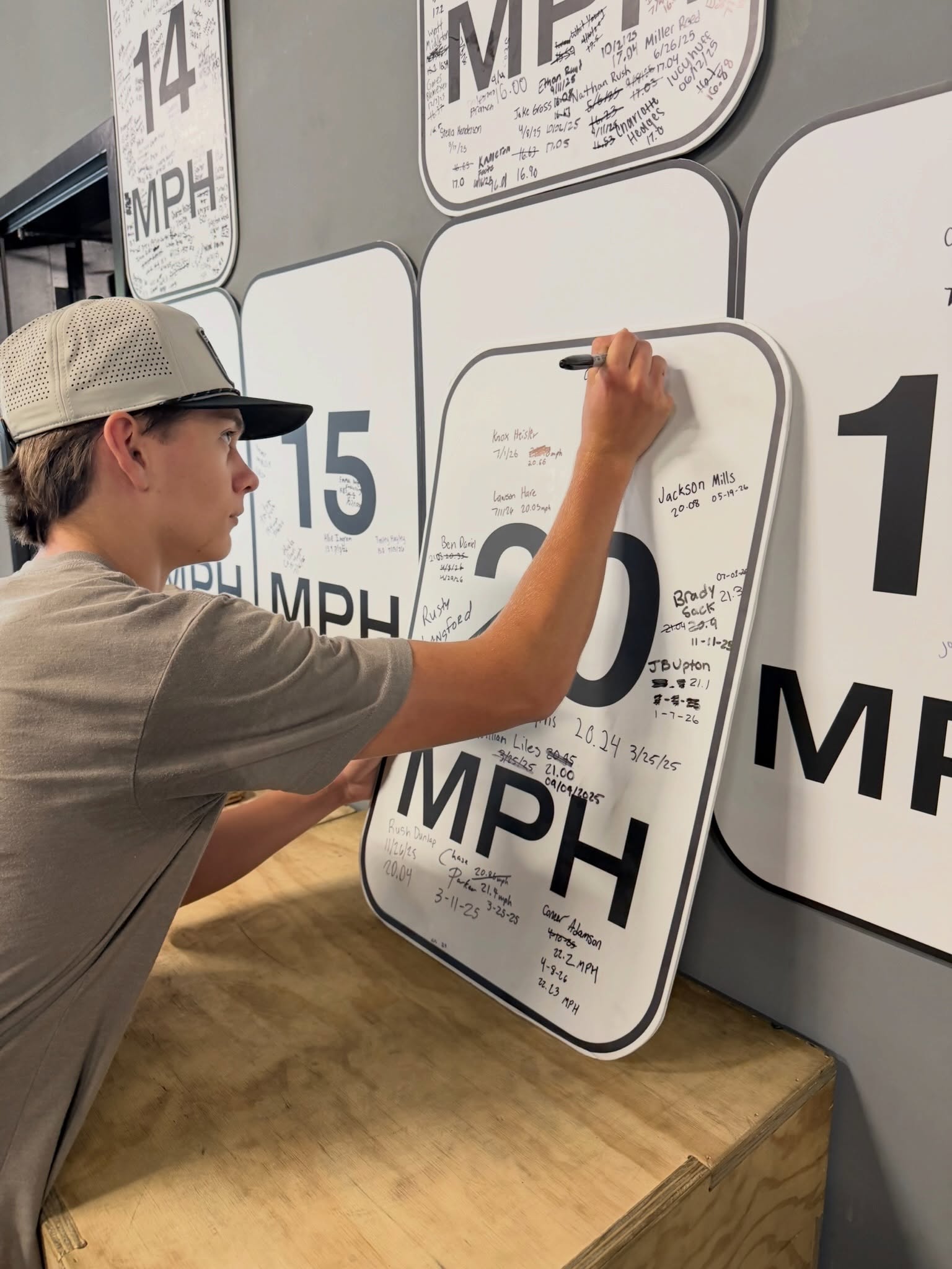 A young athlete recording a new speed milestone on the GRIT performance wall